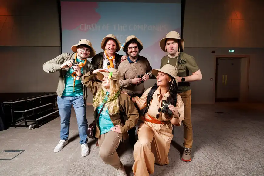 Corporate team building group dressed in safari costumes at an indoor event in Ireland