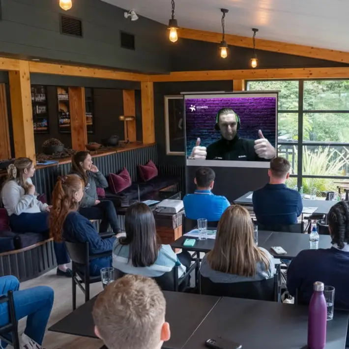 ABP Food Group graduates in Ireland receiving a live virtual briefing from a remote event host before starting their multi location digital treasure hunt.