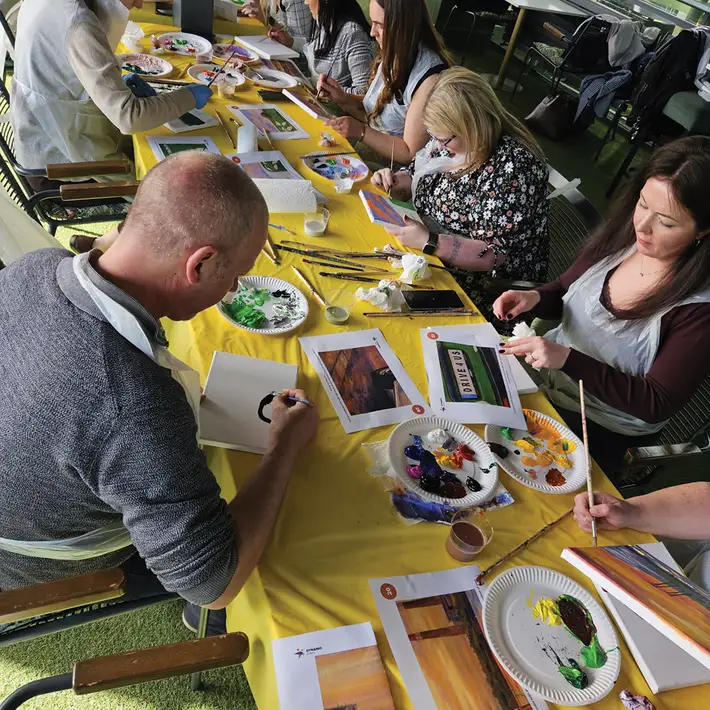 DPD Ireland team painting individual canvases during Big Picture team building activity at The Connacht Hotel Galway