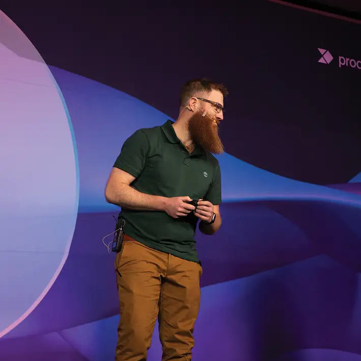 Facilitator leading team training workshop at international company kick-off event in Mexico City