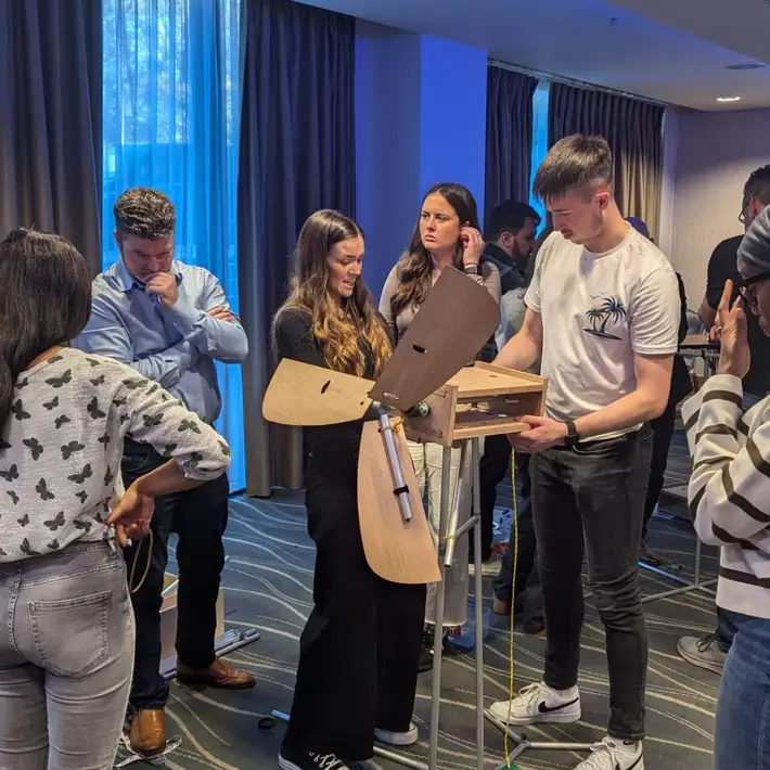 putting on the finsihing touches to thier wind turbine