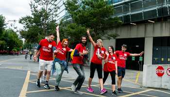 University staff team taking part in an outdoor urban team building activity in Dublin, organised by Dynamic Events Ireland.