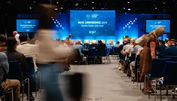 Corporate conference event at Dublin Castle managed by Dynamic Events, featuring stage setup, audience seating, and professional AV production in Ireland.