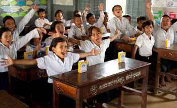 Children celebrating after receiving SolarBuddy lights in Cambodia