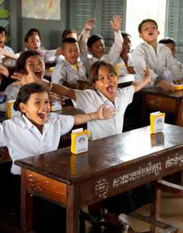 Children celebrating after receiving SolarBuddy lights in Cambodia