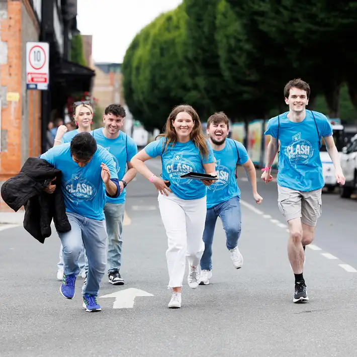 Corporate team racing through Dublin streets during a Digital Treasure Hunt team building activity in Ireland.