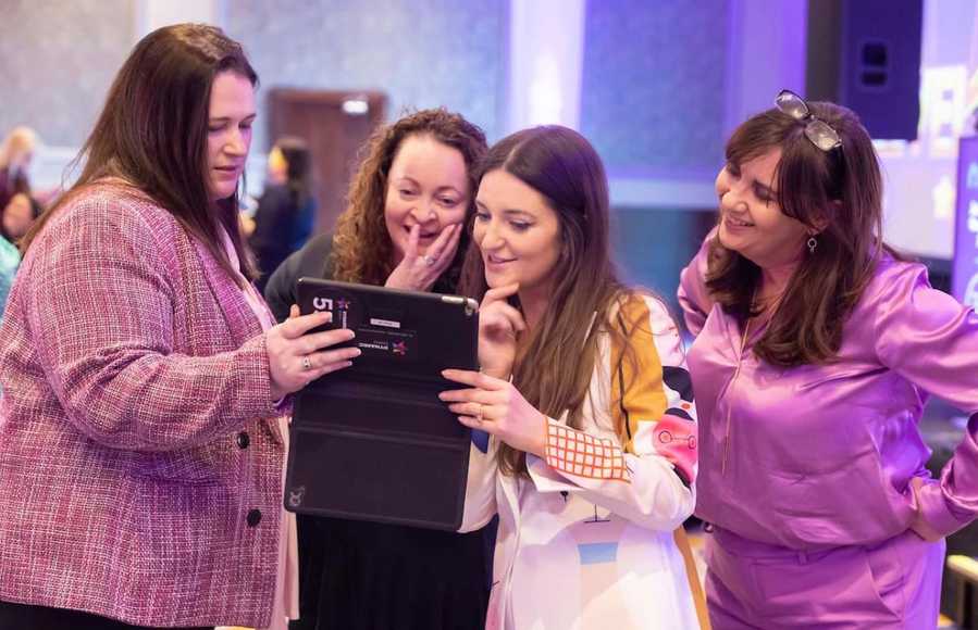 Female executives collaborating during an executive team building workshop in Dublin