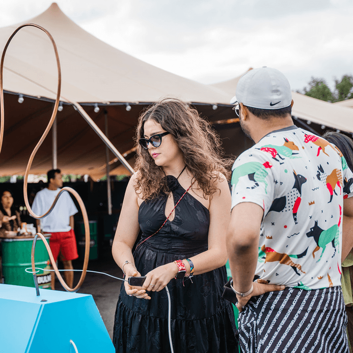 Carnival game stall in action with staff members laughing and competing