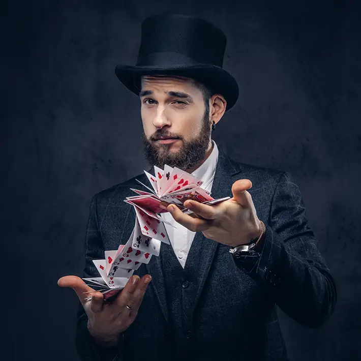 Magician pulling cards from a hat during a virtual team building magic show