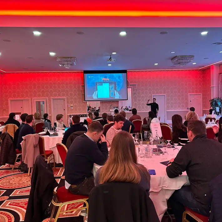 Team members looking at the briefing so they can understand what is happening with a red lit room 