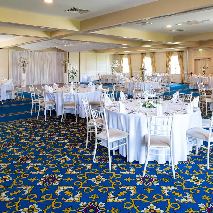 Ballroom set for a corporate gala dinner at Roganstown Hotel & Country Club