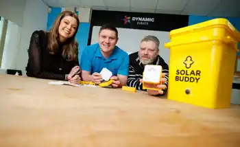 Employees engaged in assembling solar lights during a SolarBuddy activity for communities without electricity