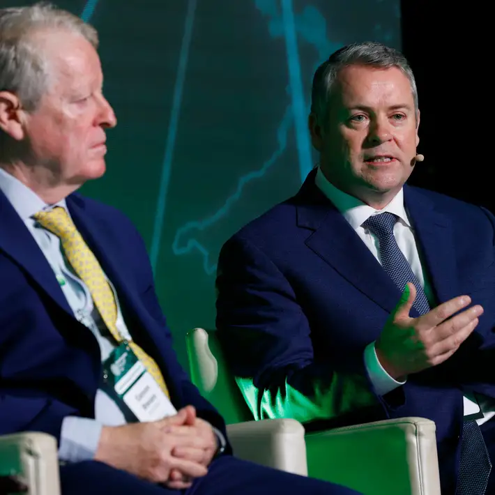 Two men on the panel talking 