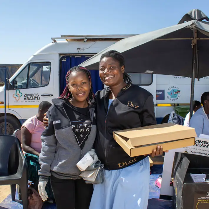 A nurse receiving a solar light to work with
