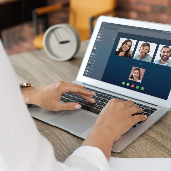 Woman on video call with team mates