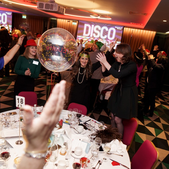 people at party playing disco bingo