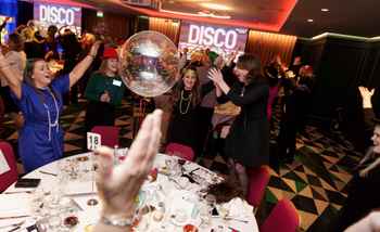 Christmas Bingo Disco With loads of people around the table