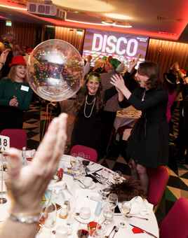 people at party playing disco bingo