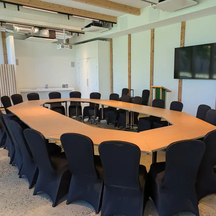 Breakout area with natural lighting and forest views through large windows