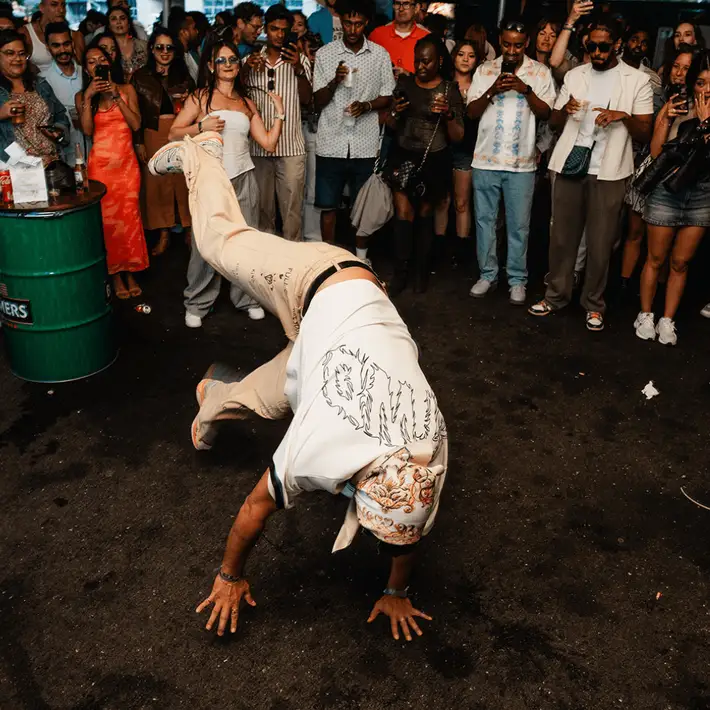 Hip hop dancer dancing in the middle of a crowd