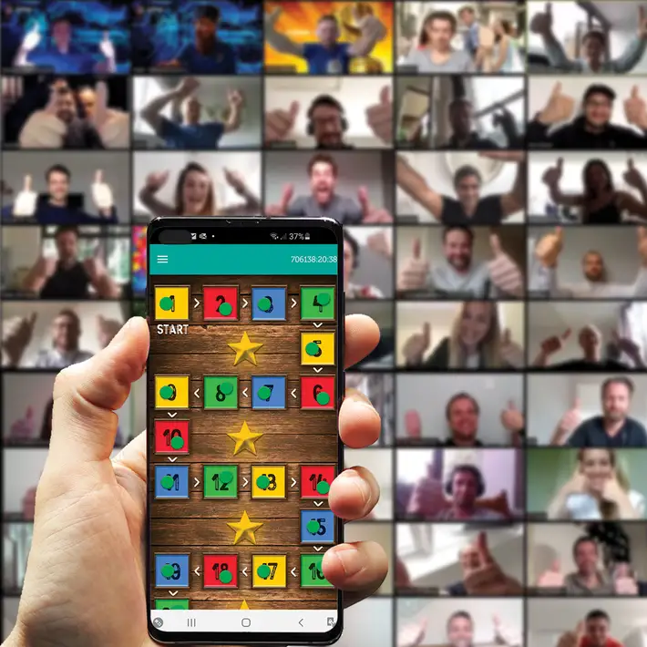 Virtual away day game screen with participants in the background