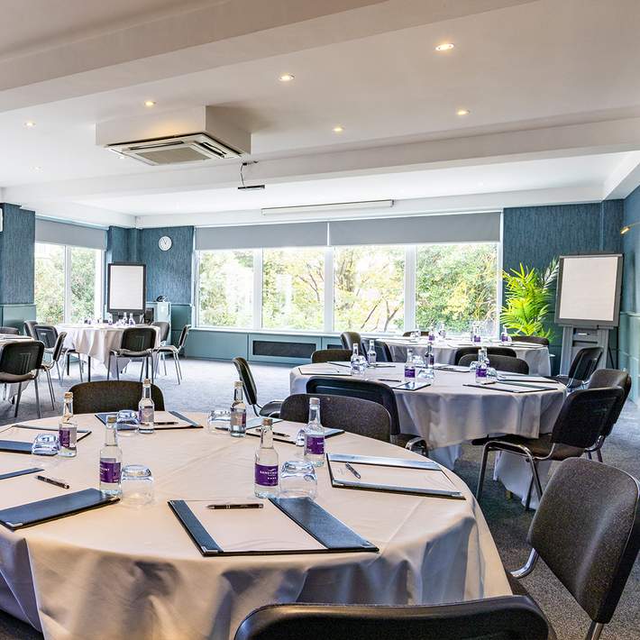 Round-table corporate meeting space at The Sandymount Hotel, perfect for strategy sessions and executive discussions in a bright, well-appointed setting.