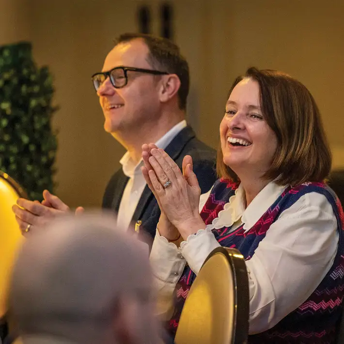 happy attendees clapping to irish music at corporate event in Dublin