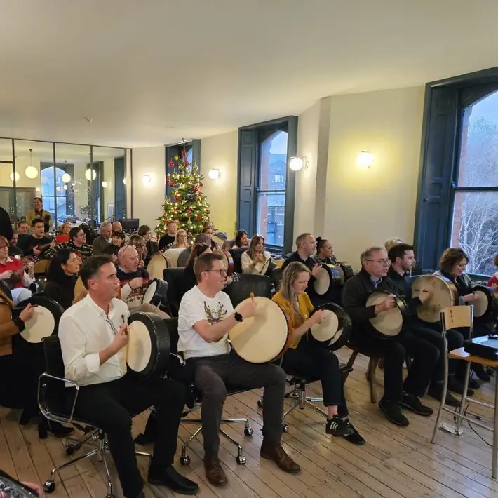 Group playing the Bodhran 