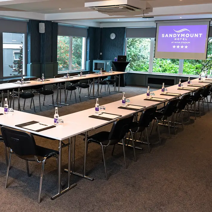 Modern conference room at The Sandymount Hotel set up in a U-shape layout, ideal for corporate meetings, presentations, and workshops.
