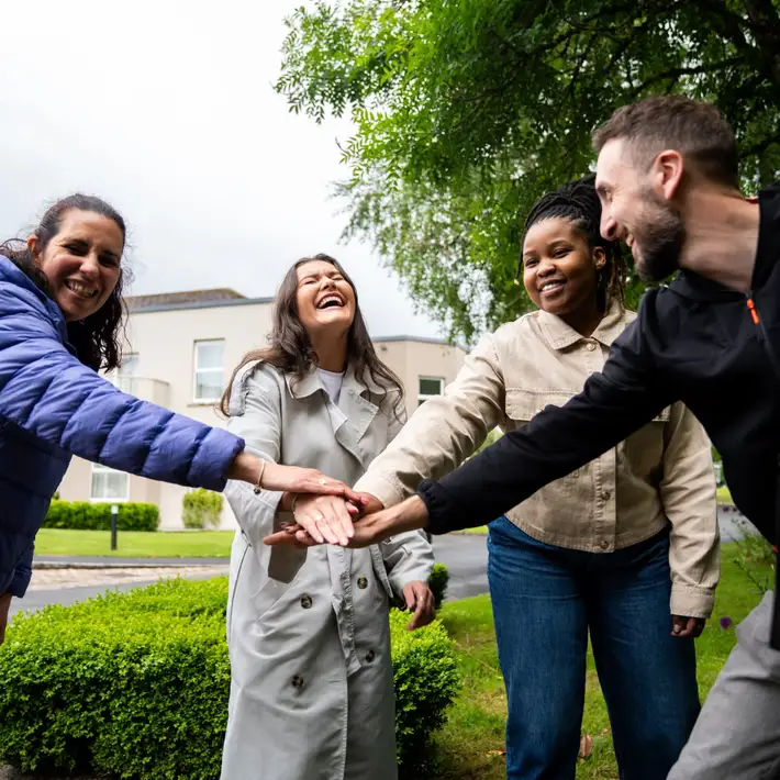Teams going all in an d creating a handshake 