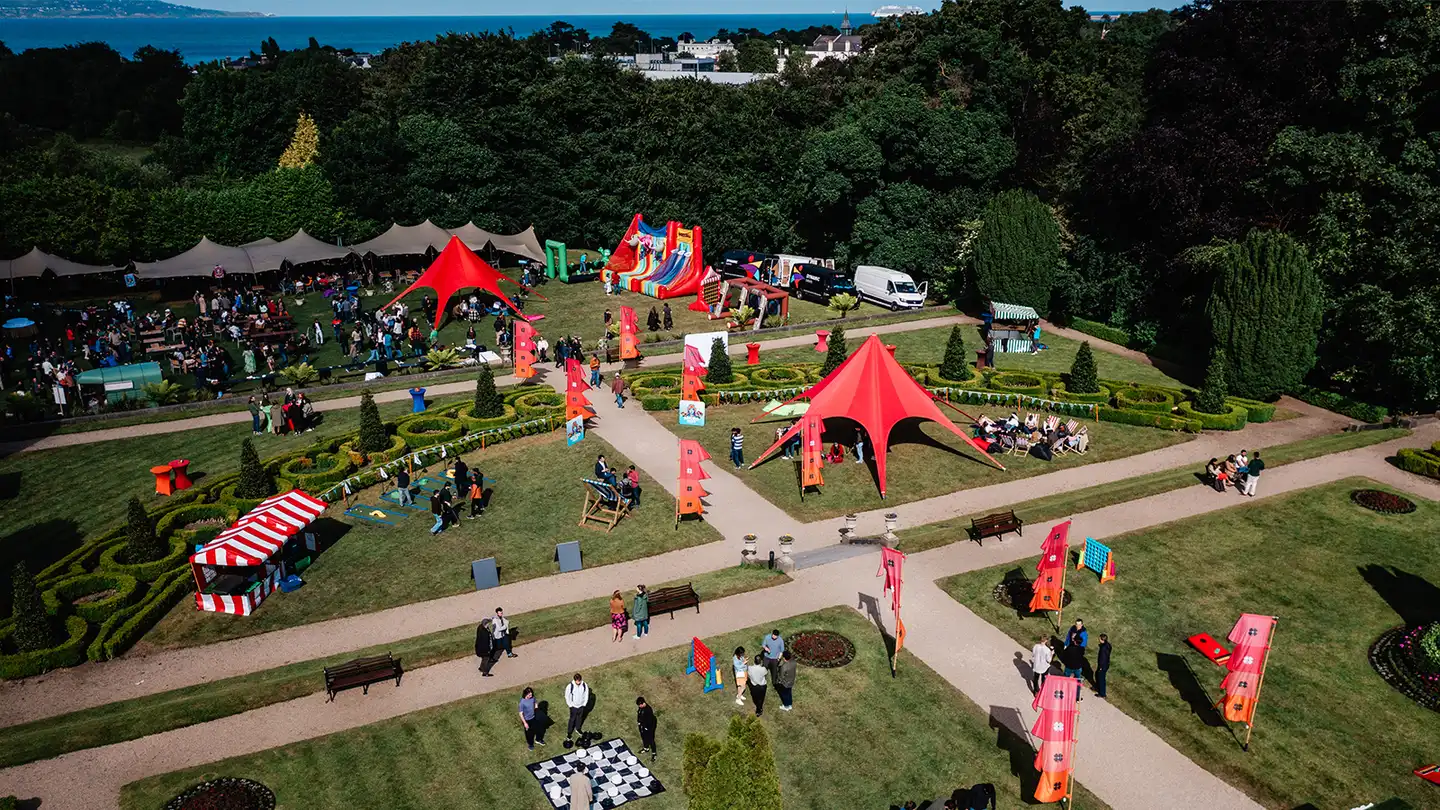 Corporate summer party event with outdoor marquees, team activities, and branded setups at an Irish venue