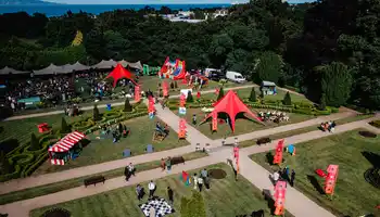 Corporate summer party event with outdoor marquees, team activities, and branded setups at an Irish venue