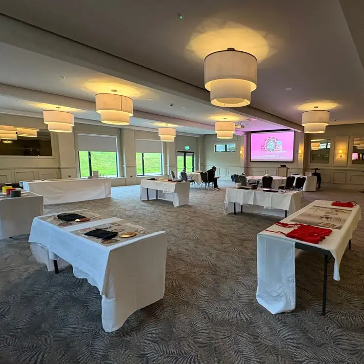 Event room prepared for the Cake Factory business simulation, with workstations ready for MBA students to engage in teamwork and stakeholder challenges.