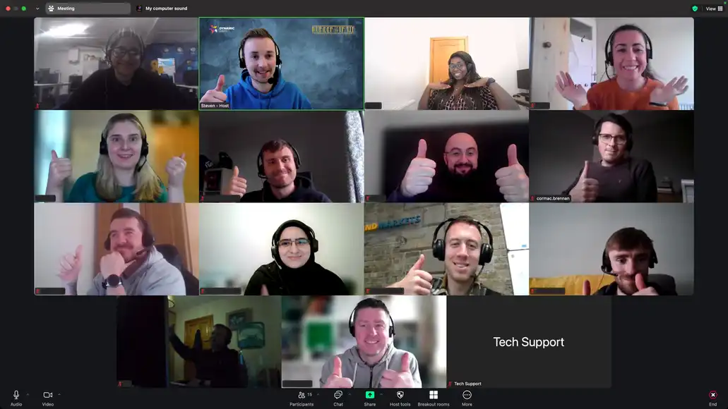 Remote team celebrating successful online collaboration with thumbs-up on Zoom