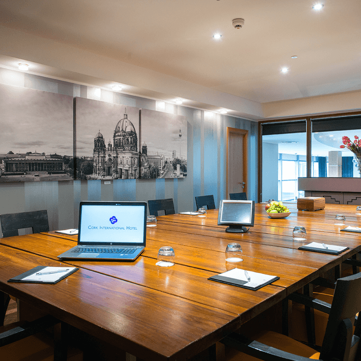 Boardroom with computer and chairs