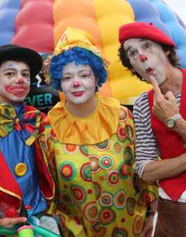 Clowns in front of hot air balloon