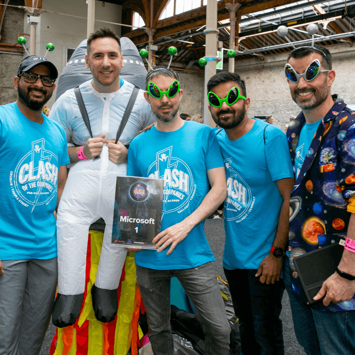 Participants unlocking clues on a mobile app during a Halloween corporate event.