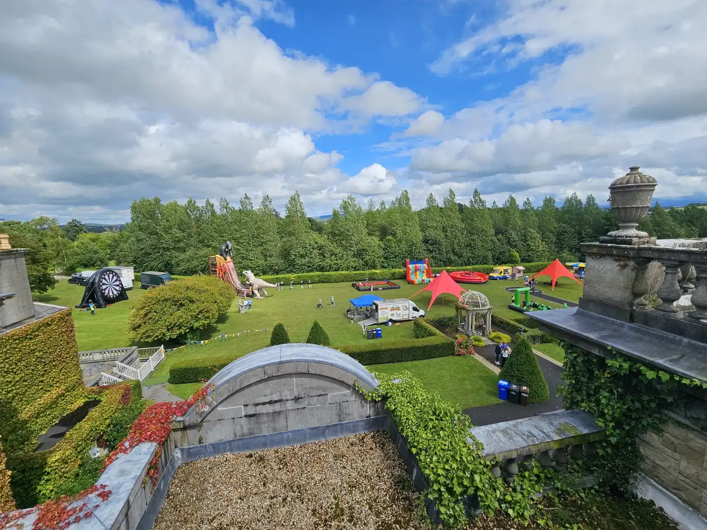 Overview of event set up from the roof of palmerstown house with blue skies.