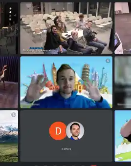 Multiple hybrid team locations on screen, with both remote participants and in-office groups waving and smiling.
