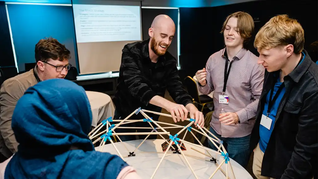 happy team doing dome works team building activity