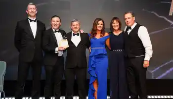 Guests celebrating at a corporate gala dinner and awards night in Ireland with live entertainment and elegant event styling