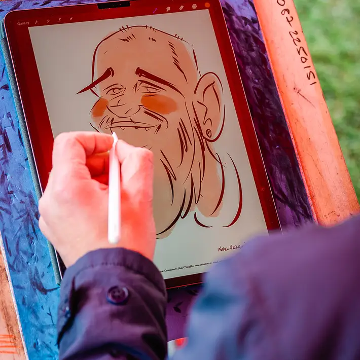 corporate team member having caricature drawn live at team building event in Ireland