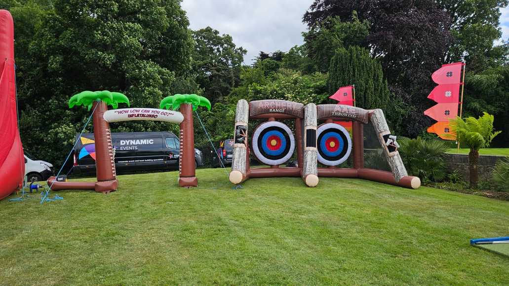 Outdoor summer team building activities in Carlow with inflatable archery and axe throwing challenges