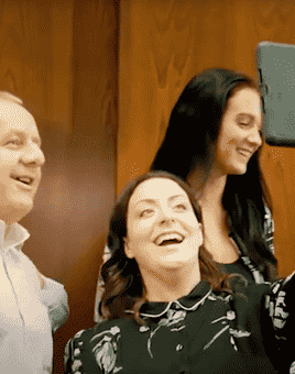 Team presenting their target audience analysis during The Pitch business simulation activity, with app-based tasks