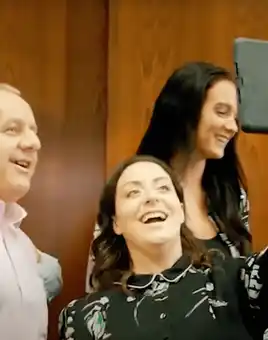 Team presenting their target audience analysis during The Pitch business simulation activity, with app-based tasks