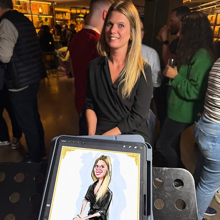 live caricature artist creating digital portrait of colleague at corporate team building workshop in Ireland