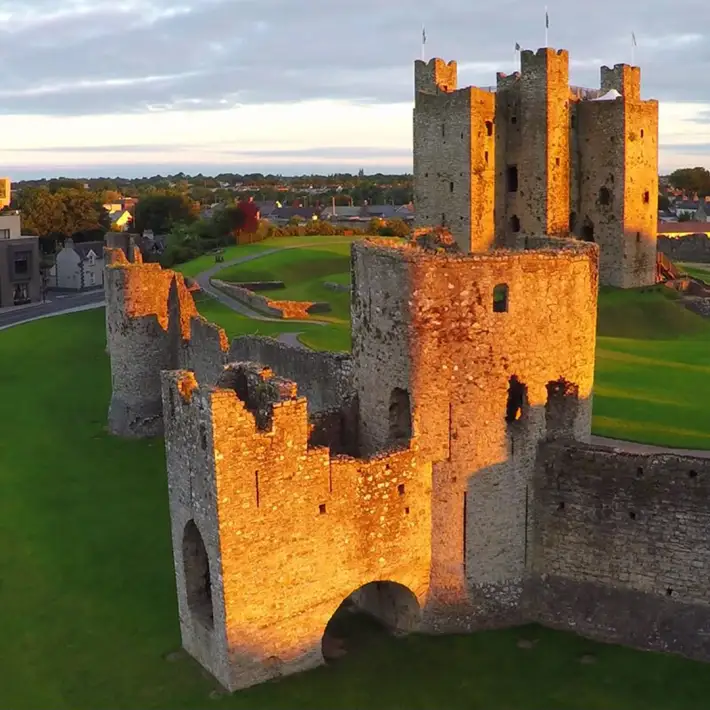 Historic Trim Castle illuminated at sunset in County Meath, Ireland