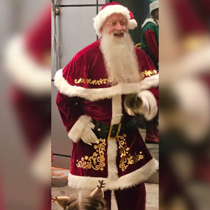 Santa chracter walking to kids