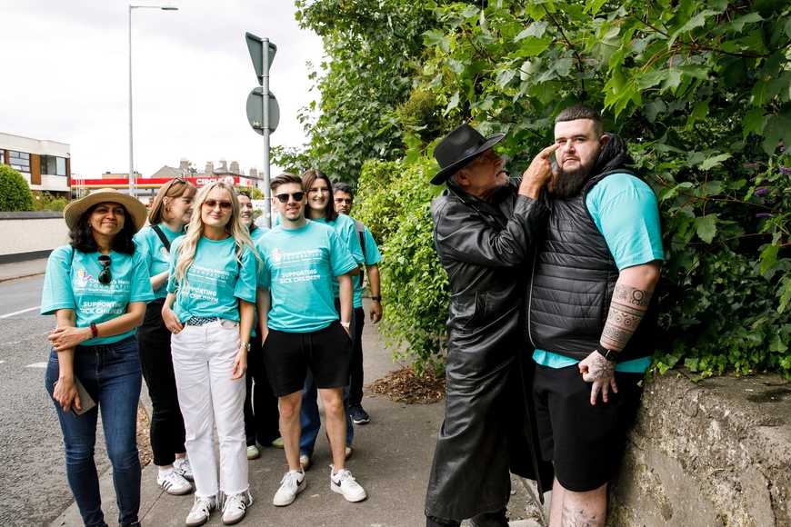 Actor interrogating a participant during a live Spy Squad challenge as part of a team building activity