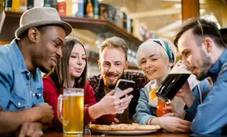 young group having fun digital treasure hunt